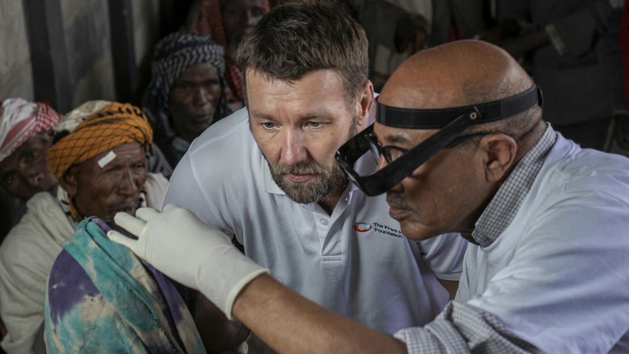 Dr Wondu Alemayehu, technical adviser to The Fred Hollows Foundation on trachoma, showing Joel the problem and the work. Picture: Michael Amendolia/Fred Hollows Foundation