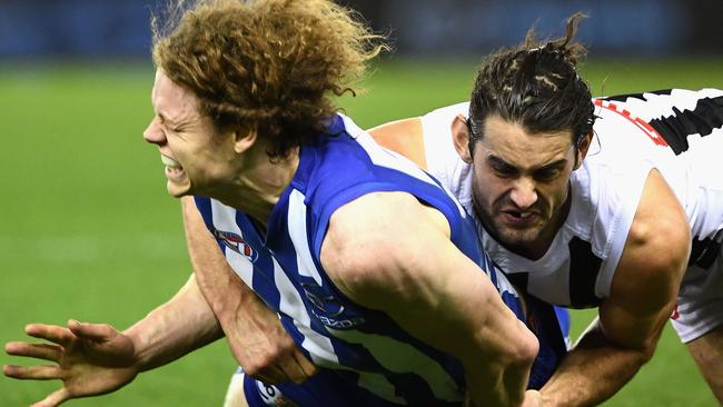 Ben Brown is tackled by Brodie Grundy on Saturday.