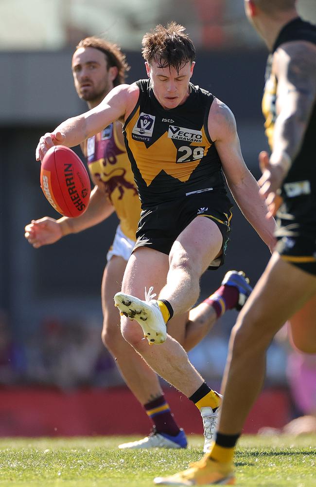 Dom Brew kicks for Werribee in its prelim final win over Brisbane Lions. Picture: Kelly Defina/AFL Photos/via Getty Images