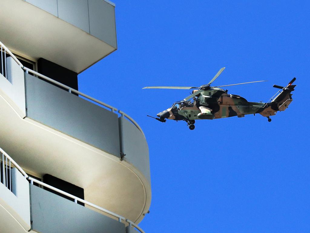 An Australian military helicopter patrols the Queensland-NSW border at the Gold Coast. Picture: Scott Powick