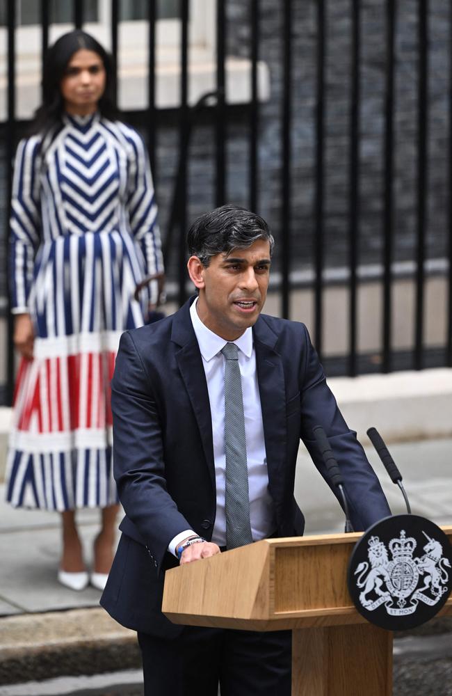 Britain's outgoing Prime Minister Rishi Sunak, watched by his wife Akshata Murty, delivers as statement after losing the general election. Picture: AFP