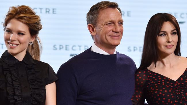 Daggy thorn among roses ... Craig with the newest Bond girls, Lea Seydoux and Monica Belucci. AFP PHOTO / BEN STANSALL