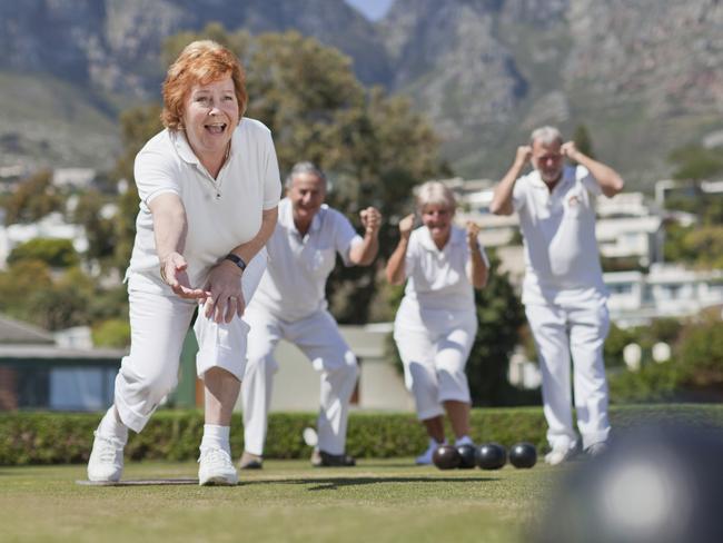 Older couples playing lawn bowling. istock image