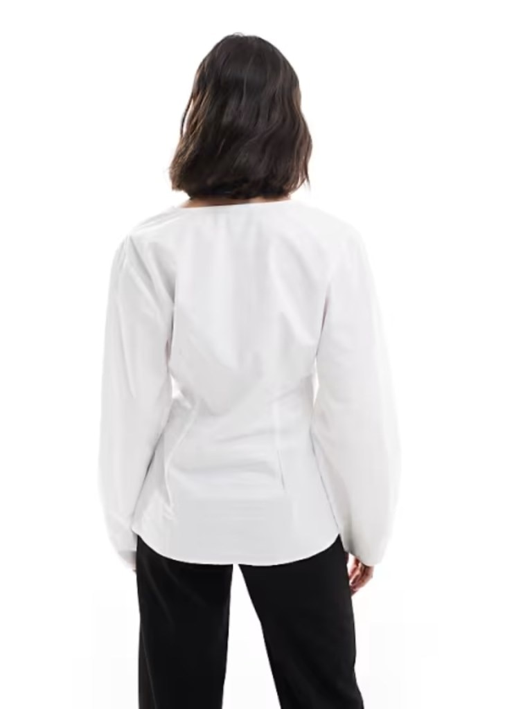 ASOS DESIGN poplin wrap placket cocoon sleeve shirt in white. Picture: ASOS.