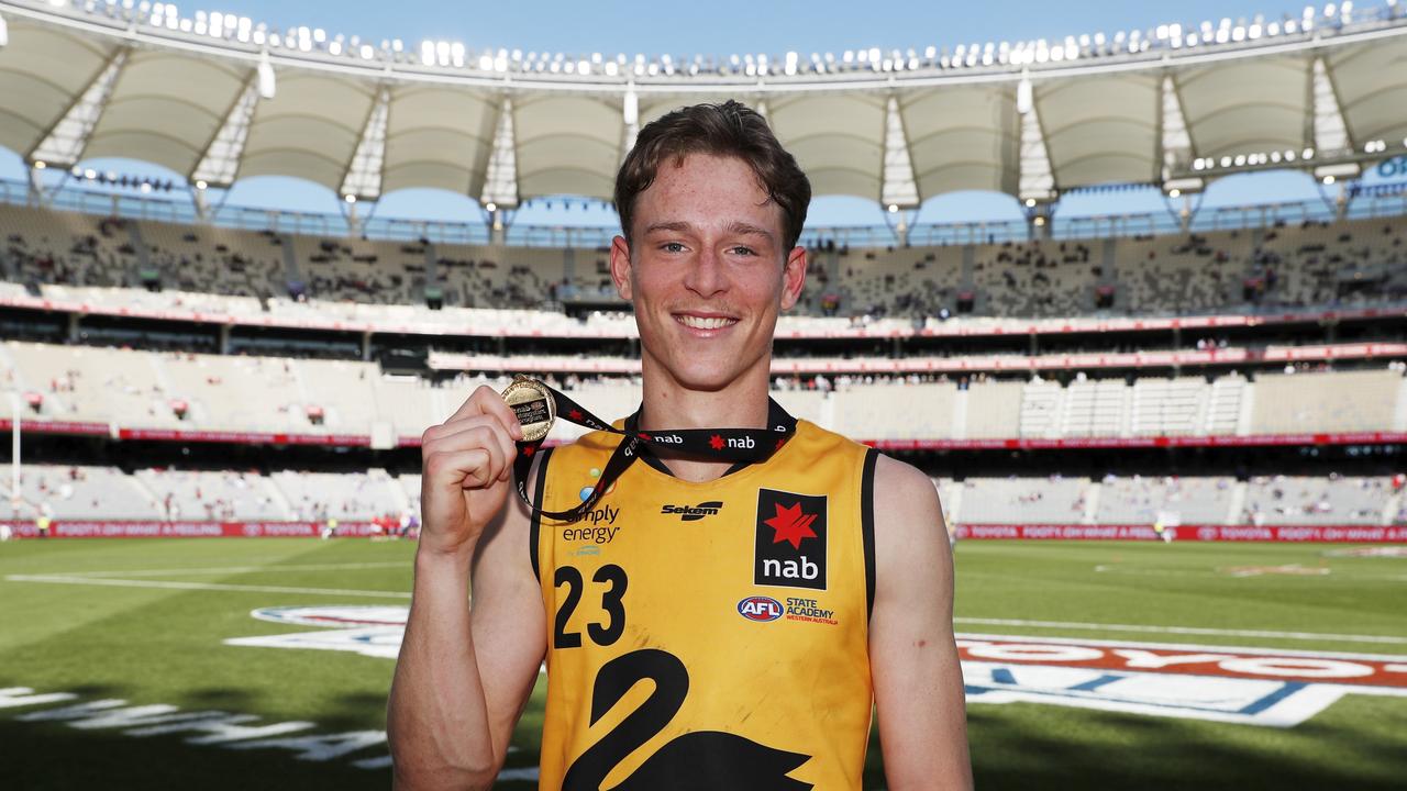 Matthew Johnson with his medal after being named as WA’s best player Picture: Dylan Burns/AFL Photos via Getty Images