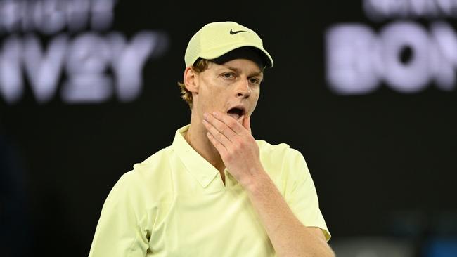 MELBOURNE, AUSTRALIA - JANUARY 16: Jannik Sinner of Italy reacts in the Men's Singles Second Round match against Tristan Schoolkate of Australia during day five of the 2025 Australian Open at Melbourne Park on January 16, 2025 in Melbourne, Australia. (Photo by Hannah Peters/Getty Images)