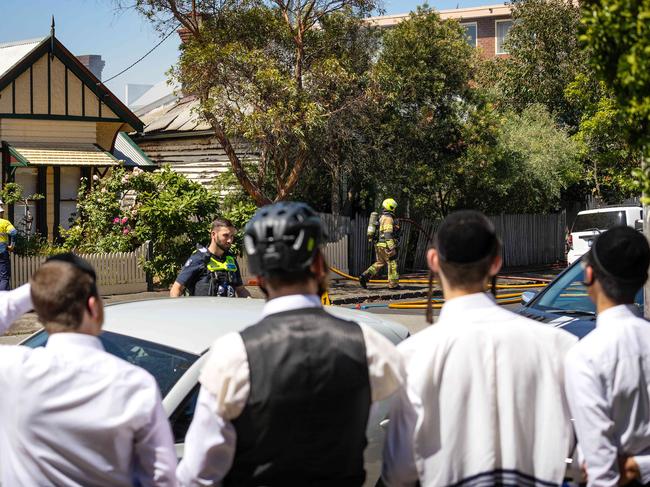 Emergency services respond as a house fire burns in Ripponlea barely 50m from the Adass Israel Synagogue. Picture: Mark Stewart