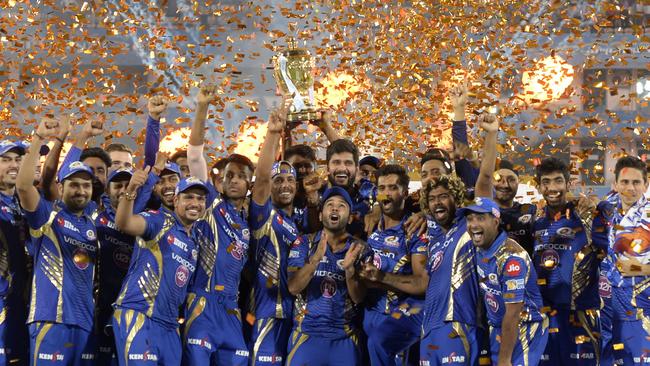 Mumbai Indians raise the IPL trophy.