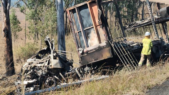 The charred remains of a semi trailer from which the driver was pulled to safety as it burned following a two truck crash on the Bruce Highway, 37km south of Miriam Vale, on August 5. Picture: Rodney Stevens