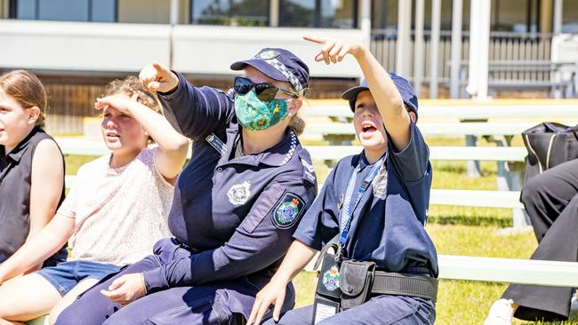 Senior constable Linette Swales and special junior constable Christopher Lowe watching PolAir land on the police oval. Picture: Richard Walker