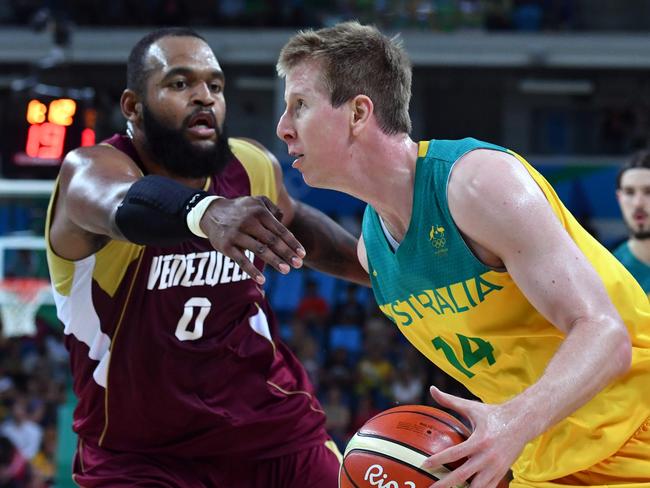 Australia's power forward Brock Motum (R) works around Venezuela's centre Gregory Echenique during a Men's round Group A basketball match between Australia and Venezuela at the Carioca Arena 1 in Rio de Janeiro on August 14, 2016 during the Rio 2016 Olympic Games. / AFP PHOTO / Andrej ISAKOVIC