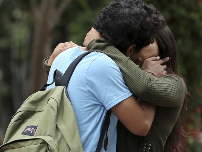 A couple kiss in a public park in Guadalajara, Mexico, as city officials order cops to look the other way. Picture: AP Photo/Refugio Ruiz