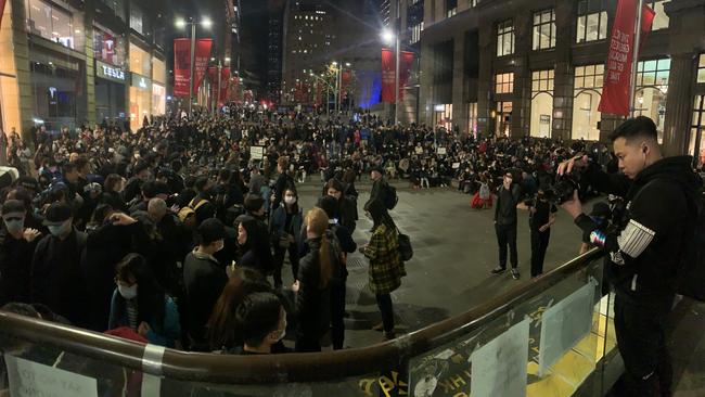 Hundreds of people wearing masks and black clothing joined a protest in Sydney’s Martin Place to show solidarity with the protesters in Hong Kong. Picture: Campbell Gellie