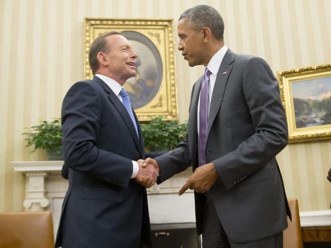 President Barack Obama shakes hands with then-prime minister Tony Abbott in the Oval Office in 2014. The two leaders discussed the Trans-Pacific Partnership. Picture: Pablo Martinez Monsivais