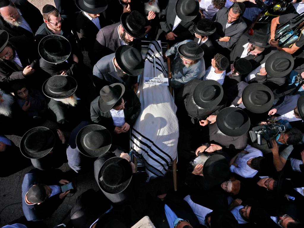 Funerals have begun commencing for those who have been formally identified. Picture: Menahem Kahana/AFP