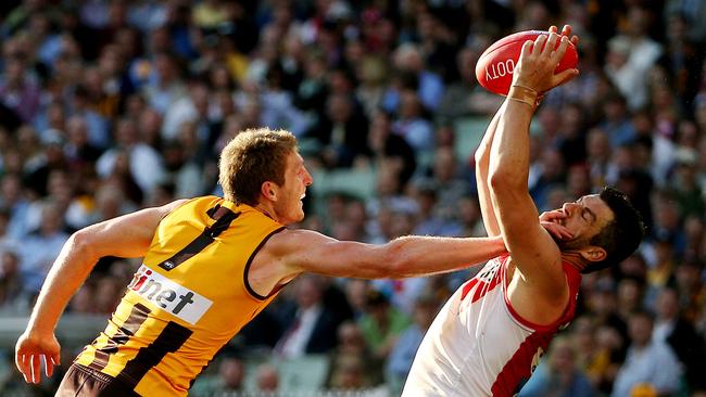 Heath Grundy marks against Ben McEvoy during the 2014 AFL grand final. Picture: Colleen Petch.