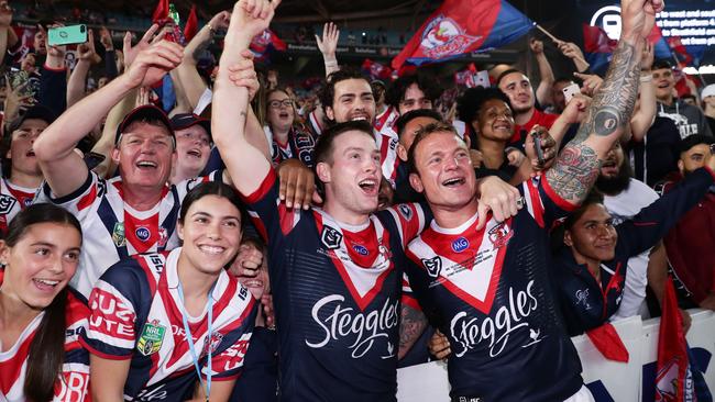 Roosters Luke Keary and Jake Friend celebrate victory with fans. Picture: Getty/Matt King