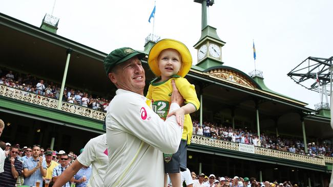 Brad Haddin and his daughter Mia during his playing days. Picture: Phil Hillyard