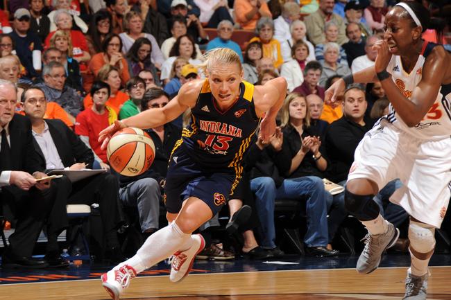 Basketballer Erin Phillips #13 of the Indiana Fever drives past Allison Hightower #23 of the Connecticut Sun during Game Three of the Eastern Conference Finals match in October 2012 at the Mohegan Sun in Uncasville, Connecticut, USA. Picture: Brian Babineau/NBAE via Getty Images