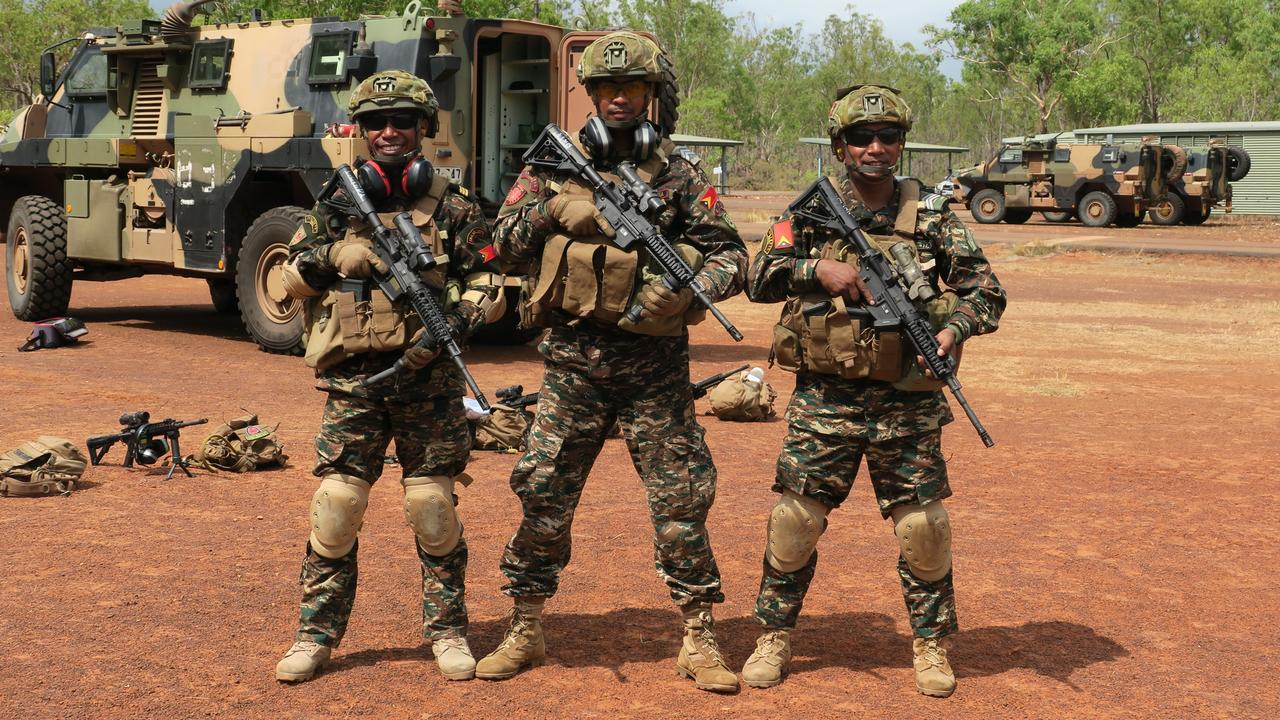 Timorese soldiers ready to shoot after their battle run