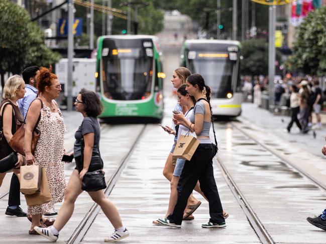 MELBOURNE, AUSTRALIA - NCA NewsWire Photos - 13 DECEMBER, 2023: People carry shopping bags while walking along Bourke Street Mall in Melbourne. Picture: NCA NewsWire / Diego Fedele