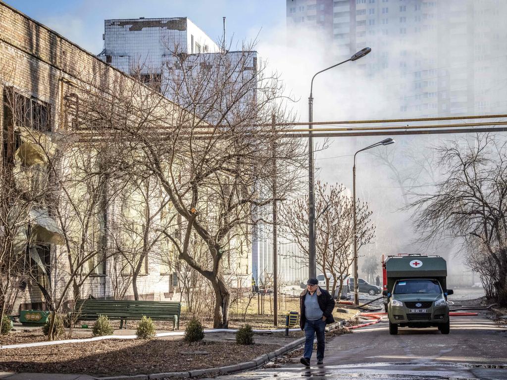 A man walks in the street after a Russian drone hit a building of the Institute for Superhard Materials, part of Ukraine's National Academy of Science, in Kyiv. Picture: AFP