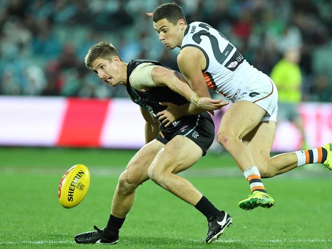 Hartlett and Giant Josh Kelly battle for the ball. Picture: Tom Huntley.