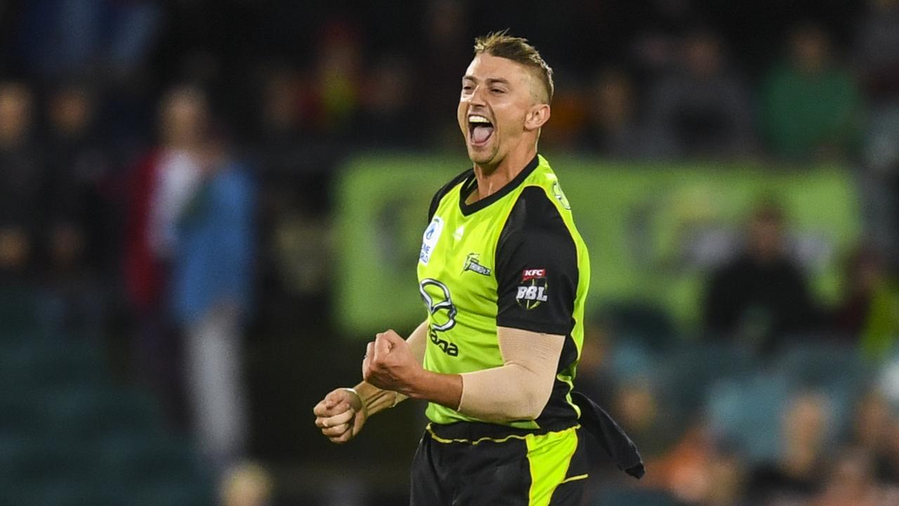 Daniel Sams of the Sydney Thunder celebrates after claiming a wicket