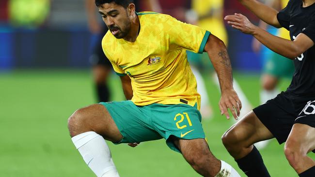 BRENTFORD, ENGLAND - OCTOBER 17: Massimo Luongo of Australia is challenged by Eliah Just of New Zealand during the Trans-Tasman Trophy international friendly match between Australia Subway Socceroos and New Zealand All Whites at Gtech Community Stadium on October 17, 2023 in Brentford, England. (Photo by Bryn Lennon/Getty Images)