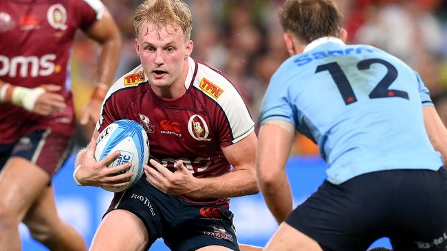 BRISBANE, AUSTRALIA - FEBRUARY 24: Tom Lynagh of the Reds looks to take on the defence during the round one Super Rugby Pacific match between Queensland Reds and NSW Waratahs at Suncorp Stadium, on February 24, 2024, in Brisbane, Australia.  (Photo by Bradley Kanaris/Getty Images)