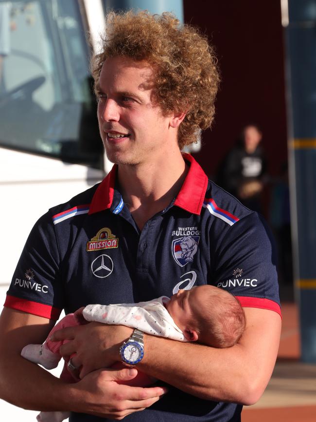 Mitch Wallis arrives with newbord daughter Charlotte. Picture: Glenn Hampson