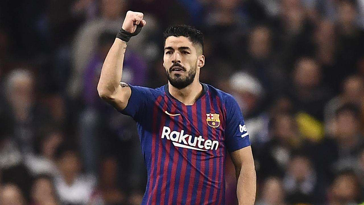 Luis Suarez bagged a double to help Barcelona take out Real Madrid. 
