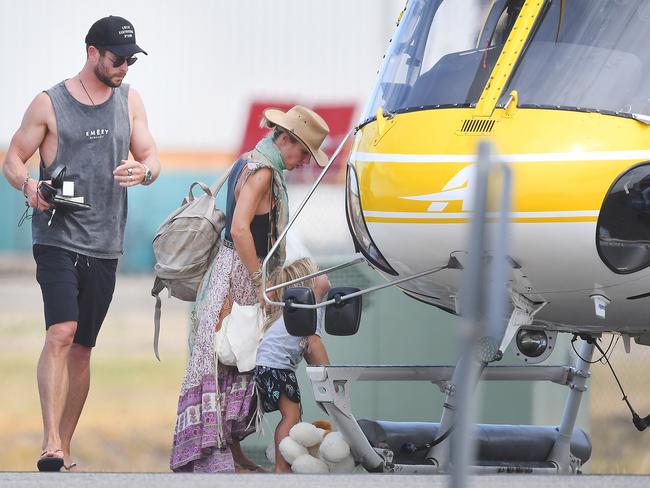 Australian actor Chris Hemsworth at Adelaide Airport, boarding a helicopter with his family on Thursday. Picture: Mark Brake