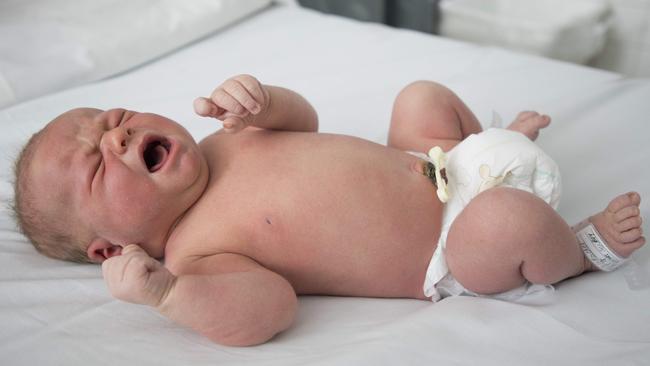 Lachlan Adams gives the lungs a stretch at two days old at Westmead Hospital. Picture: Chris Pavlich