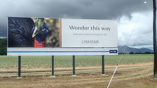 A sign near Mission Beach advertising Mayfair Iconic Properties' investment in the region.