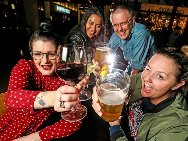 Ami Denniss, 28, Juanita Bahl, 27, John Steer, 52 and Natasha Busbridge, 31, toast to the new study. Picture: Tim Carrafa.