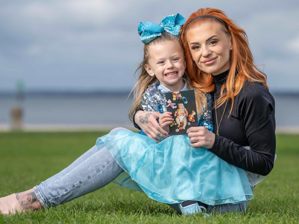 13-05-2024 Kandace Lane, with her daughter Gypsy, is raising awareness for the dangers of strangulation in the home after her sister Tahlee Rose Strachan ( in photograph)passed away 21 years ago.  Picture: Brad Fleet