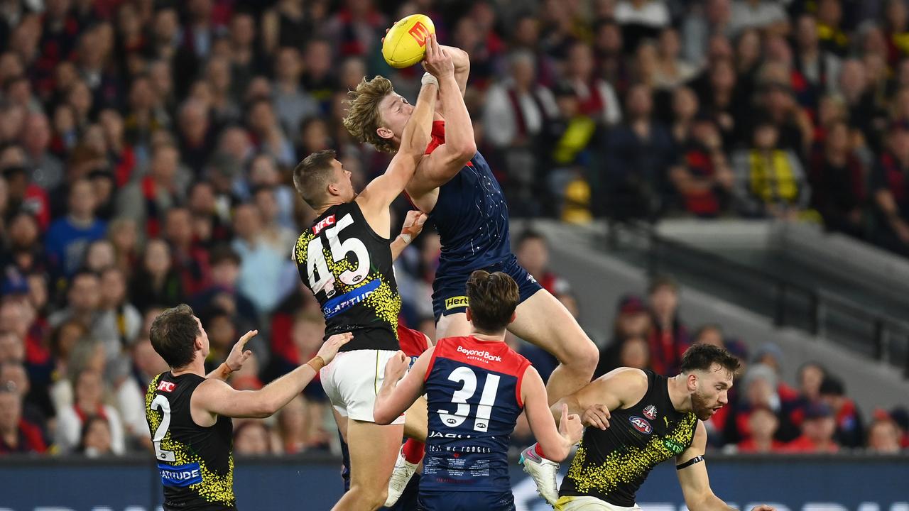 Demon forward Jacob Van Rooyen soars over the top of the Richmond defence. Picture: Quinn Rooney/Getty Images