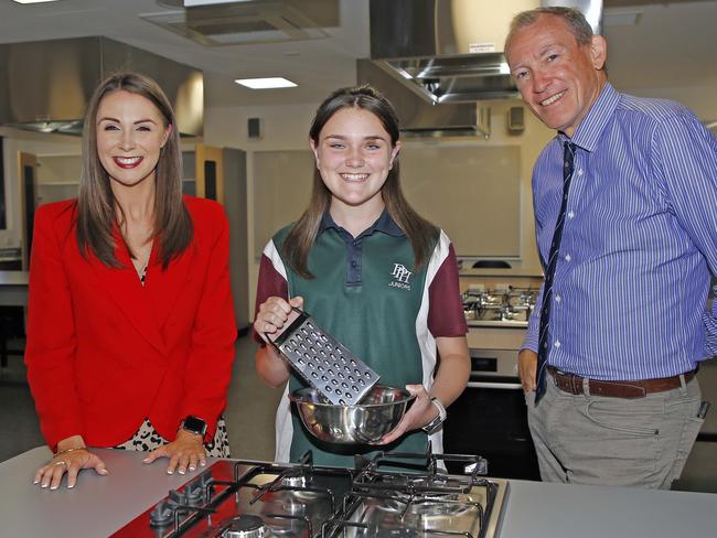 Gaven MP Meaghan Scanlon, student Frankie Hinds and School principal Mark Peggrem at the opening of the new $25 million junior learning precinct at Pacific Pines State High School. Photo: Tertius Pickard.