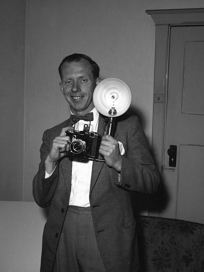 Vic Grimmett holding a Zeiss Ikon Super Ikonta B camera.