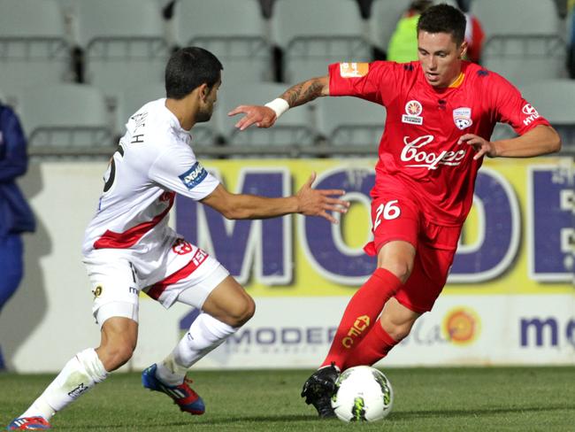 Liam Wooding in action for Adelaide United on his A-League debut against Melbourne Heart in 2012.