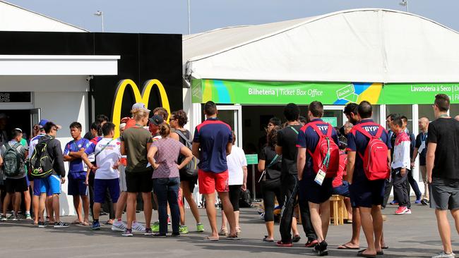 Queues are all part of the Olympic experience, such as here at a McDonalds in one of the Rio venues. Picture: Cameron Tandy