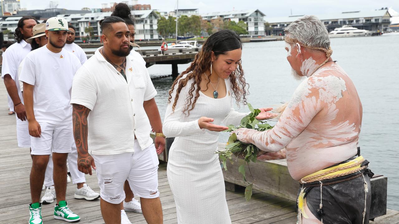 Te Aranganui Choir members are seen during a smoking ceremony at Watermans Cove in Barangaroo during the launch of the Sydney Festival for 2024. Picture: NCA Newswire/ Gaye Gerard