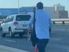 Wild moment man rides e-scooter on West Gate Freeway