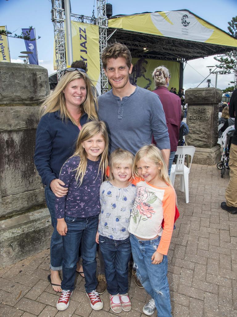 Fernando and Marie Lulli pose for a photograph with daughters Alana, 8, Annaliese, 4, and Evelyn, 6, during the Manly Jazz festival Picture: Troy Snook