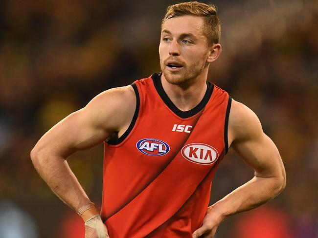 Devon Smith  of the Bombers reacts after the Round 22 AFL match between the Richmond Tigers and the Essendon Bombers at the MCG in Melbourne, Friday, August 17, 2018. (AAP Image/Julian Smith) NO ARCHIVING, EDITORIAL USE ONLY