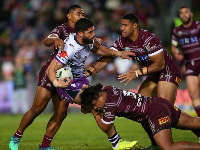 SYDNEY, AUSTRALIA - JULY 14:  Jesse Bromwich of the Storm is tackled during the round 18 NRL match between the Manly Sea Eagles and the Melbourne Storm at Lottoland on July 14, 2018 in Sydney, Australia.  (Photo by Jason McCawley/Getty Images)