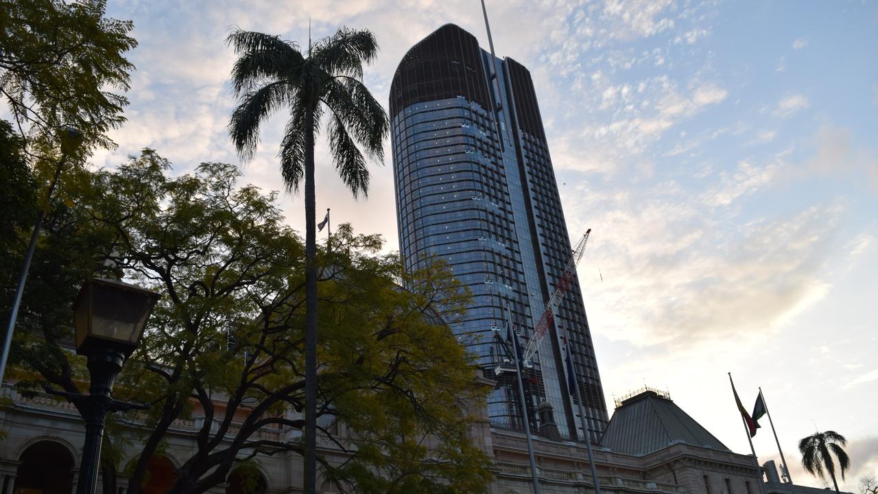 The Queensland Government’s Executive Building 1 William St - home to many public servants - towers over Parliament House.