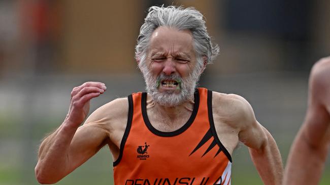 Rob Newling competes in the 800m barefoot. Picture: Andy Brownbill