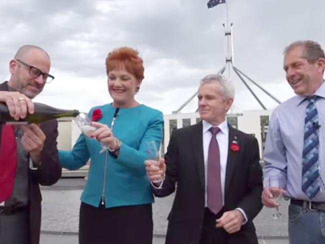 09/11/2016 Pauline Hanson celebrates Donald Trump's victory with Malcolm Roberts (2nd R) in front of Parliament House. Source: Facebook